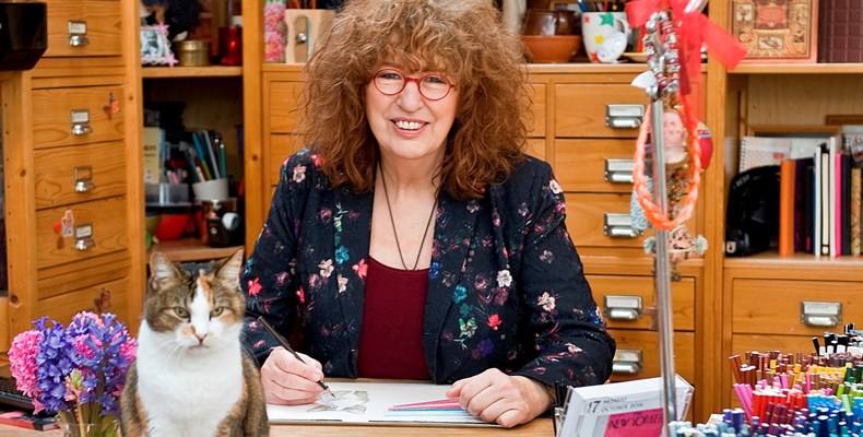 Francien van Westering tekent roodborstjes voor de kerstkaarten van de Zonnebloem